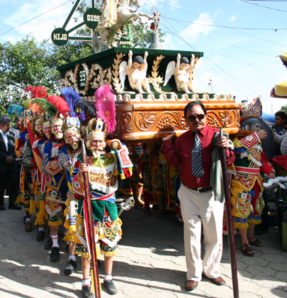 Dancers participating in the procession carrying the image of Santiago